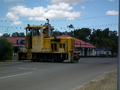 Eric. M. Plomley. (ComEng, AD, G1023) - pre-rebuild - crossing the road back into the bulk sugar terminal yards. October 2014.
