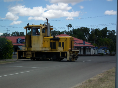 Eric. M. Plomley. (ComEng, AD, G1023) - pre-rebuild - crossing the road back into the bulk sugar terminal yards. October 2014.